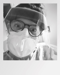 Nurse wearing face mask.